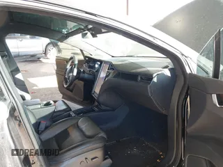 2020 Tesla Model X Long Range with VIN 5YJXCDE24LF272242, listed as a IAAI auction lot 41275226 with 103,731 mi miles. Bid and sale history available at carsss.com. Image 5.