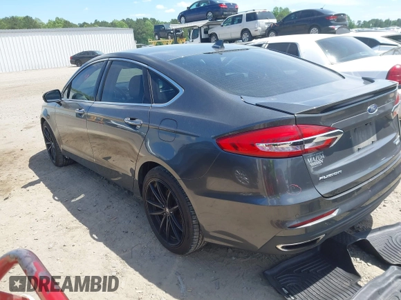 2019 Ford Fusion Titanium with VIN 3FA6P0D9XKR152617, listed as a IAAI auction lot 42209470 with 135,956 mi miles and . Bid and sale history available at DreamBid. Image 3.