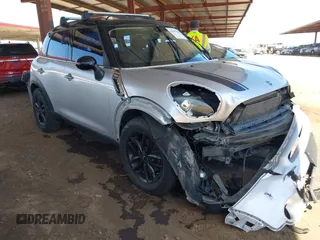 2014 MINI Countryman S z VIN WMWZC3C56EWP27328, wystawiony jako IAAI lot #42187458 z przebiegiem 140 616 mil mil oraz . Historia ofert i sprzedaży dostępna na DreamBid. Obrazek 1.
