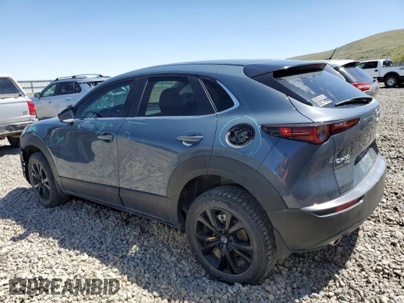 2023 Mazda CX-30 S Carbon Edition with VIN 3MVDMBCM1PM524019, listed as a Copart auction lot 57079355 with 46,737 mi miles and Salvage title. Bid and sale history available at DreamBid. Image 2.