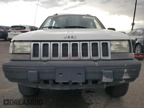 1995 Jeep Grand Cherokee Laredo with VIN 1J4GZ58Y6SC718918, listed as a Copart auction lot 72226394 with 212,670 mi miles and Salvage Title. Bid and sale history available at carsss.com. Image 5.