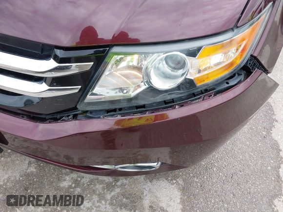 2014 Honda Odyssey Touring with VIN 5FNRL5H9XEB073156, listed as a IAAI auction lot 41990714 with 166,129 mi miles and . Bid and sale history available at DreamBid. Image 6.