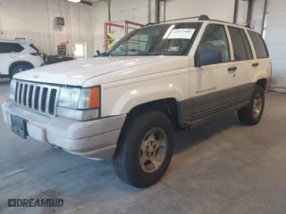 1997 Jeep Grand Cherokee Laredo with VIN 1J4GZ58SXVC552435, listed as a IAAI auction lot 41977888 with 143,832 mi miles. Bid and sale history available at carsss.com. Image 2.