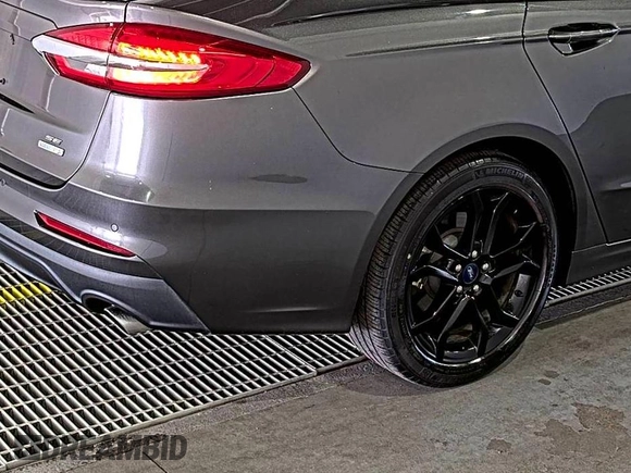 2020 Ford Fusion SE z VIN 3FA6P0HD6LR189762, wystawiony jako IAAI lot #42780149 z przebiegiem 51 099 mil mil oraz . Historia ofert i sprzedaży dostępna na DreamBid. Obrazek 25.