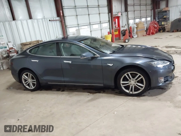 2014 Tesla Model S 60 with VIN 5YJSA1H16EFP52853, listed as a IAAI auction lot 41941989 with 132,038 mi miles and . Bid and sale history available at DreamBid. Image 13.