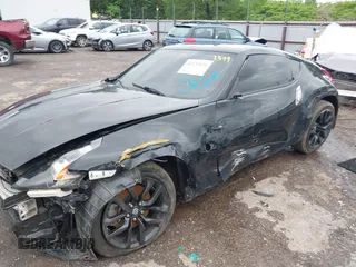 2020 Nissan 370Z Sport z VIN JN1AZ4EH6LM823399, wystawiony jako IAAI lot #42135621 z przebiegiem 98 855 mil mil oraz . Historia ofert i sprzedaży dostępna na DreamBid. Obrazek 6.