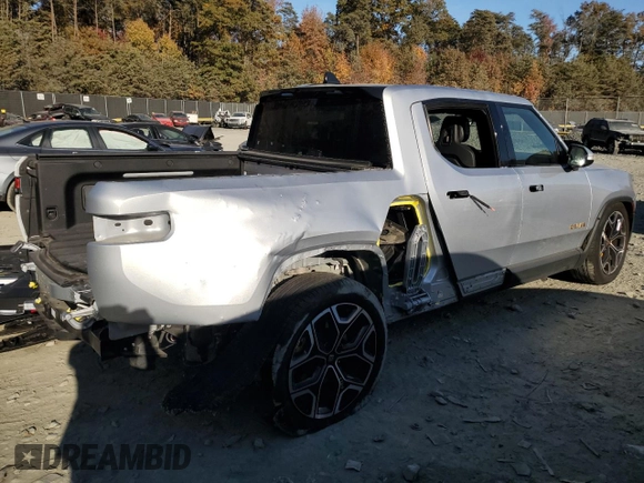 2022 Rivian R1T Launch Edition z VIN 7FCTGAAL6NN002704, wystawiony jako Copart lot #77913144 z przebiegiem 40 665 mil mil oraz Szkoda całkowita • Salvage title. Historia ofert i sprzedaży dostępna na DreamBid. Obrazek 3.