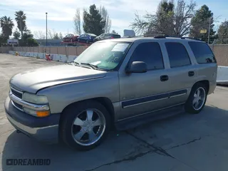 2001 Chevrolet Tahoe LS with VIN 1GNEK13T51J203013, listed as a IAAI auction lot 41886371 with 218,779 mi miles. Bid and sale history available at carsss.com. Image 2.