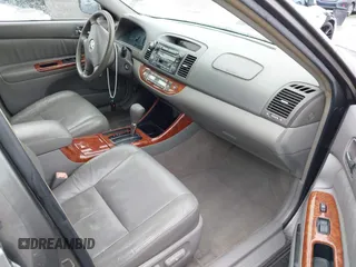 2004 Toyota Camry LE with VIN JTDBF32K740152841, listed as a IAAI auction lot 41808909 with 142,611 mi miles. Bid and sale history available at carsss.com. Image 5.