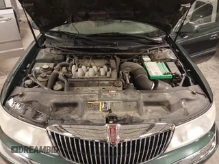 2001 Lincoln Continental with VIN 1LNHM97V11Y691910, listed as a IAAI auction lot 41501779 with 102,715 mi miles. Bid and sale history available at carsss.com. Image 10.