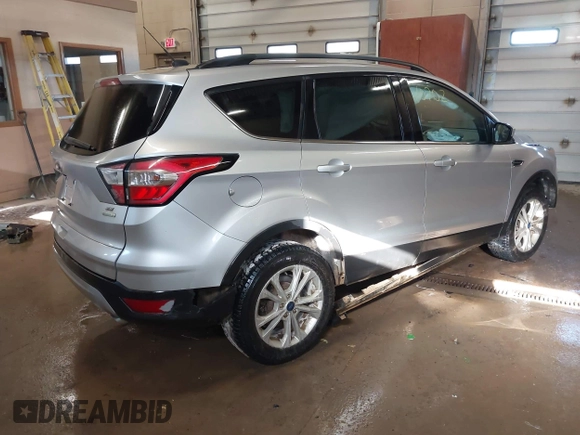 2018 Ford Escape SE with VIN 1FMCU0G94JUB62791, listed as a IAAI auction lot 41410702 with 115,180 mi miles. Bid and sale history available at carsss.com. Image 4.