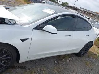 2024 Tesla Model 3 Long Range with VIN 5YJ3E1EB7RF854092, listed as a IAAI auction lot 41697646 with 7,371 mi miles and . Bid and sale history available at DreamBid. Image 14.