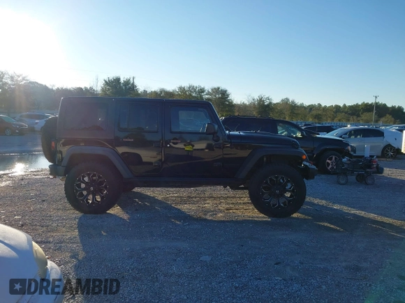 2015 Jeep Wrangler Unlimited Rubicon with VIN 1C4BJWFGXFL610153, listed as a IAAI auction lot 41575401 with 114,583 mi miles. Bid and sale history available at carsss.com. Image 13.