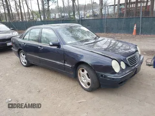 2002 Mercedes-Benz E-Class AWD with VIN WDBJF83J32X068355, listed as a IAAI auction lot 41872613 with 143,501 mi miles. Bid and sale history available at carsss.com. Image 1.