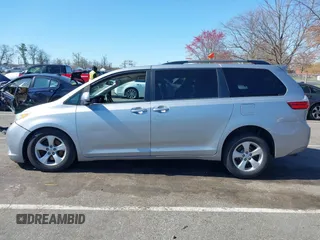 2015 Toyota Sienna LE AAS with VIN 5TDKK3DC0FS663826, listed as a IAAI auction lot 42050229 with 126,971 mi miles and . Bid and sale history available at DreamBid. Image 14.