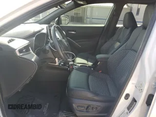 2023 Toyota Corolla Cross Hybrid S with VIN 7MUFBABG5PV008595, listed as a Copart auction lot 60002585 with 9,052 mi miles and Salvage title. Bid and sale history available at DreamBid. Image 7.