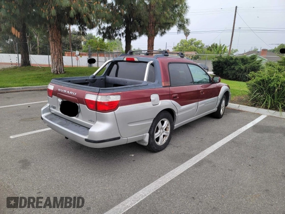 2003 Subaru Baja with VIN 4S4BT61C736109032, listed as a Copart auction lot 56075085 with 178,863 mi miles and Salvage Title. Bid and sale history available at DreamBid. Image 4.