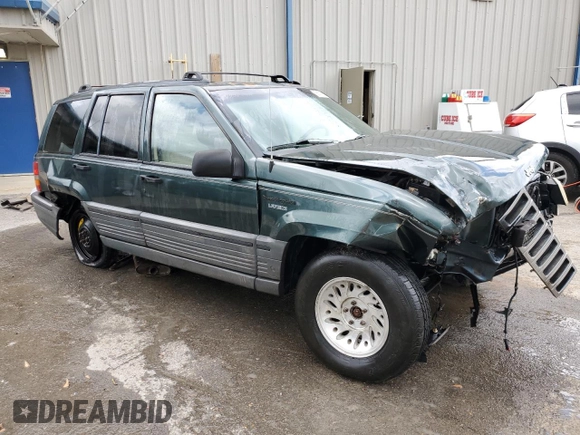1995 Jeep Grand Cherokee Laredo with VIN 1J4FX58S8SC773884, listed as a Copart auction lot 56572555 with 424,126 mi miles and Salvage title. Bid and sale history available at DreamBid. Image 4.