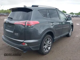 2017 Toyota RAV4 Hybrid Limited with VIN JTMDJREV8HD144858, listed as a IAAI auction lot 42092847 with 135,046 mi miles. Bid and sale history available at carsss.com. Image 4.