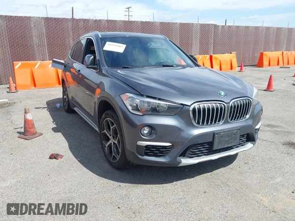 2018 BMW X1 xDrive28i with VIN WBXHT3C30J5L34702, listed as a IAAI auction lot 41935803 with 42,174 mi miles. Bid and sale history available at carsss.com. Image 1.