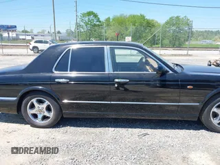 1999 Bentley Arnage z VIN SCBLB51E1XCX01401, wystawiony jako IAAI lot #42133144 z przebiegiem 29 699 mil mil oraz . Historia ofert i sprzedaży dostępna na DreamBid. Obrazek 13.