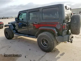 2012 Jeep Wrangler Unlimited Altitude with VIN 1C4HJWEGXCL180602, listed as a Copart auction lot 61391095 with 187,205 mi miles and Salvage title. Bid and sale history available at DreamBid. Image 2.