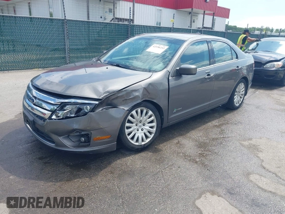 2011 Ford Fusion Hybrid with VIN 3FADP0L32BR132155, listed as a IAAI auction lot 42196233 with 77,900 mi miles and . Bid and sale history available at DreamBid. Image 2.