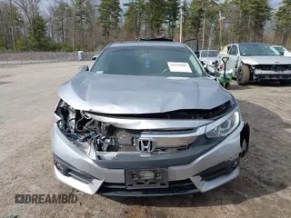 2018 Honda Civic EX-T z VIN 2HGFC1F34JH641837, wystawiony jako IAAI lot #41858089 z przebiegiem 65 318 mil mil oraz . Historia ofert i sprzedaży dostępna na DreamBid. Obrazek 12.