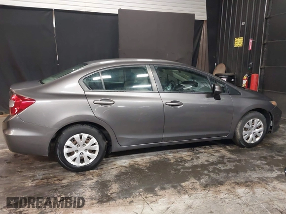 2012 Honda Civic LX z VIN 19XFB2F59CE373830, wystawiony jako IAAI lot #42312118 z przebiegiem 106 541 mil mil oraz . Historia ofert i sprzedaży dostępna na DreamBid. Obrazek 13.