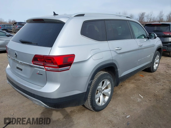 2018 Volkswagen Atlas SE with VIN 1V2KR2CA6JC560411, listed as a IAAI auction lot 41887472 with 168,155 mi miles and . Bid and sale history available at DreamBid. Image 4.