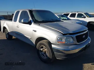 1999 Ford F-150 with VIN 1FTZX1729XKA58767, listed as a IAAI auction lot 41392815 with 342,029 mi miles and . Bid and sale history available at DreamBid. Image 1.