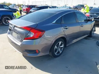 2020 Honda Civic LX z VIN 19XFC2F68LE023059, wystawiony jako IAAI lot #41856327 z przebiegiem 84 499 mil mil oraz . Historia ofert i sprzedaży dostępna na DreamBid. Obrazek 4.
