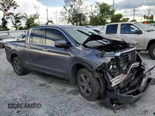 2023 Honda Ridgeline RTL-E with VIN 5FPYK3F79PB010418, listed as a Copart auction lot 62272845 with 39,739 mi miles and Salvage title. Bid and sale history available at DreamBid. Image 4.