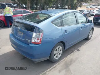 2005 Toyota Prius with VIN JTDKB20U957040822, listed as a IAAI auction lot 42129542 with 214,455 mi miles. Bid and sale history available at carsss.com. Image 4.