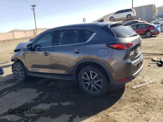 2018 Mazda CX-5 Grand Touring with VIN JM3KFADMXJ1323646, listed as a Copart auction lot 46857825 with 62,262 mi miles and Salvage title. Bid and sale history available at DreamBid. Image 2.