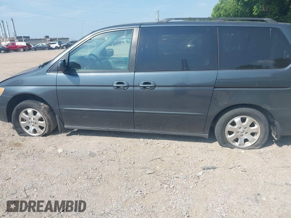 2004 Honda Odyssey EX-L z VIN 5FNRL18944B047627, wystawiony jako IAAI lot #42589724 z przebiegiem 224 371 mil mil oraz . Historia ofert i sprzedaży dostępna na DreamBid. Obrazek 6.