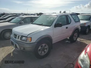 2001 Isuzu Rodeo z VIN 4S2CK57W614340766, wystawiony jako Copart lot #73891524 z przebiegiem 124 446 mil mil oraz Nie do naprawy. Historia ofert i sprzedaży dostępna na DreamBid. Obrazek 1.