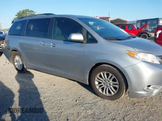 2015 Toyota Sienna XLE with VIN 5TDYK3DC9FS610925, listed as a IAAI auction lot 42022267 with 153,997 mi miles. Bid and sale history available at carsss.com. Image 1.