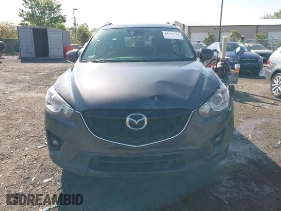 2014 Mazda CX-5 Grand Touring with VIN JM3KE4DY2E0312952, listed as a IAAI auction lot 42138721 with 99,993 mi miles and . Bid and sale history available at DreamBid. Image 12.
