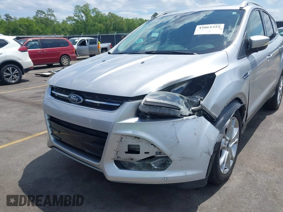 2014 Ford Escape Titanium with VIN 1FMCU0JX7EUA28824, listed as a IAAI auction lot 42065325 with 107,761 mi miles. Bid and sale history available at carsss.com. Image 6.