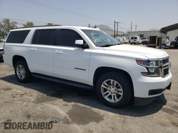 2019 Chevrolet Suburban LT with VIN 1GNSCHKCXKR207233, listed as a Copart auction lot 55410464 with 107,500 mi miles and Salvage Title. Bid and sale history available at DreamBid. Image 4.