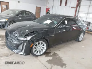 2021 Cadillac CT5 Luxury z VIN 1G6DX5RK0M0147667, wystawiony jako IAAI lot #41398726 z przebiegiem 50 387 mil mil oraz . Historia ofert i sprzedaży dostępna na DreamBid. Obrazek 2.