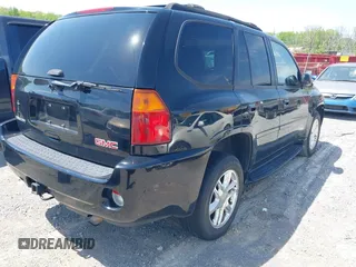 2006 GMC Envoy Denali with VIN 1GKES63M262344853, listed as a IAAI auction lot 42024960 with 183,066 mi miles. Bid and sale history available at carsss.com. Image 4.