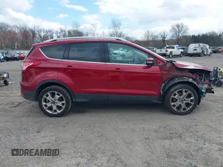 2016 Ford Escape Titanium with VIN 1FMCU9JX2GUA89716, listed as a IAAI auction lot 41899786 with 85,474 mi miles and . Bid and sale history available at DreamBid. Image 13.