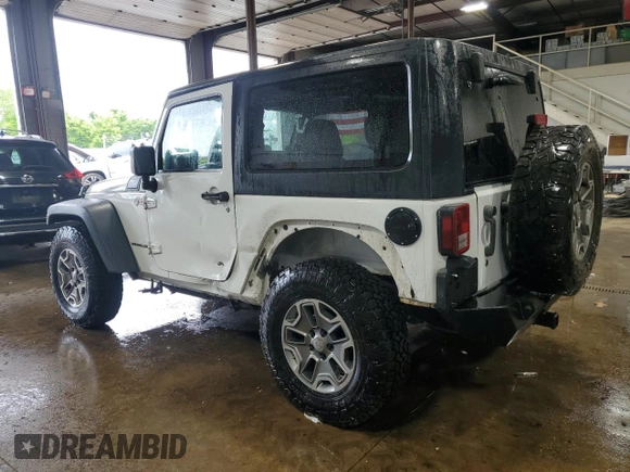 2013 Jeep Wrangler Rubicon 10th Anniversary z VIN 1C4BJWCGXDL543958, wystawiony jako Copart lot #58492255 z przebiegiem 94 455 mil mil oraz Szkoda całkowita • Salvage title. Historia ofert i sprzedaży dostępna na DreamBid. Obrazek 2.
