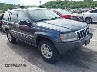 2003 Jeep Grand Cherokee Laredo z VIN 1J4GW48S13C619956, wystawiony jako IAAI lot #42204894 z przebiegiem 168 747 mil mil oraz . Historia ofert i sprzedaży dostępna na DreamBid. Obrazek 1.