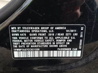 2012 Volkswagen Passat SE with VIN 1VWBP7A37CC021336, listed as a IAAI auction lot 41724459 with 124,832 mi miles. Bid and sale history available at carsss.com. Image 9.