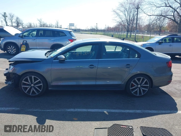 2014 Volkswagen Jetta GLI z VIN 3VW4T7AJ6EM360187, wystawiony jako IAAI lot #41932099 z przebiegiem 71 647 mil mil oraz . Historia ofert i sprzedaży dostępna na DreamBid. Obrazek 14.