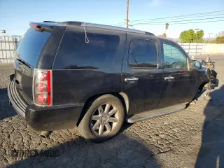 2013 GMC Yukon Denali with VIN 1GKS1EEF0DR205906, listed as a Copart auction lot 87969385 with 128,283 mi miles and Salvage Title. Bid and sale history available at carsss.com. Image 3.