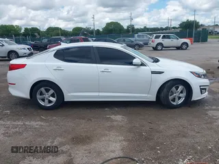 2015 Kia Optima LX with VIN KNAGM4A74F5653459, listed as a IAAI auction lot 42443188 with 109,129 mi miles and . Bid and sale history available at DreamBid. Image 14.